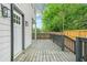 Spacious wood back porch features a railing, yard views, and access to the home at 1090 Mcdaniel St, Atlanta, GA 30310
