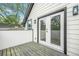 Private balcony with wooden deck, glass door, and white siding at 1090 Mcdaniel St, Atlanta, GA 30310