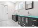 Bright bathroom with white marble tile, and sinks and decorative mirrors at 1090 Mcdaniel St, Atlanta, GA 30310