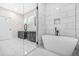 Luxurious bathroom features a stand alone soaking tub, walk in shower and double vanity sinks at 1090 Mcdaniel St, Atlanta, GA 30310