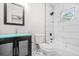 Bathroom features tiled shower, modern fixtures, and a vanity with turquoise countertop at 1090 Mcdaniel St, Atlanta, GA 30310