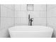 Freestanding white bathtub with modern black fixtures at 1090 Mcdaniel St, Atlanta, GA 30310