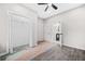 Bright bedroom features new gray floors, ceiling fan, closet and attached bathroom at 1090 Mcdaniel St, Atlanta, GA 30310
