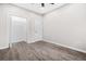 Bedroom featuring gray flooring, a ceiling fan, a closet, and a neutral color palette at 1090 Mcdaniel St, Atlanta, GA 30310