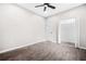 Bedroom with gray floors, ceiling fan and closet at 1090 Mcdaniel St, Atlanta, GA 30310