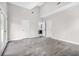 Spacious bedroom with high ceilings, light gray walls, double doors leading to an ensuite at 1090 Mcdaniel St, Atlanta, GA 30310