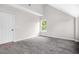 Bright bedroom features high ceilings, modern light fixture, and light gray walls at 1090 Mcdaniel St, Atlanta, GA 30310