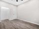 Bedroom with hardwood floors, walk-in closet, and white doors at 1090 Mcdaniel St, Atlanta, GA 30310