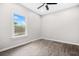 Cozy bedroom featuring hardwood floors, a ceiling fan, and a window at 1090 Mcdaniel St, Atlanta, GA 30310