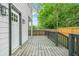 Side deck features painted wood, dark trim, and access to the fenced in yard at 1090 Mcdaniel St, Atlanta, GA 30310