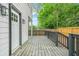 Side deck features painted wood, dark trim, and access to the fenced in yard at 1090 Mcdaniel St, Atlanta, GA 30310