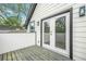 Private deck with white siding and outdoor access through French doors provides a peaceful retreat at 1090 Mcdaniel St, Atlanta, GA 30310