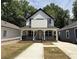 Charming two-story home with a covered front porch and freshly landscaped yard at 1090 Mcdaniel St, Atlanta, GA 30310