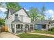 Home exterior showcases a well-manicured lawn and inviting covered front porch at 1090 Mcdaniel St, Atlanta, GA 30310