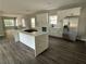 Modern kitchen with white cabinets, sleek countertops, and a functional center island with barstool seating at 1090 Mcdaniel St, Atlanta, GA 30310