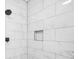 Modern shower featuring sleek black fixtures and a niche for storage at 1090 Mcdaniel St, Atlanta, GA 30310