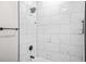 Modern shower showcasing white marble tile and black hardware at 1090 Mcdaniel St, Atlanta, GA 30310