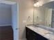 Bathroom featuring granite countertop, mirror, and lighting at 339 Morgan Se Pl, Atlanta, GA 30317