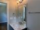 Bathroom with granite countertop, mirror, and modern lighting at 339 Morgan Se Pl, Atlanta, GA 30317