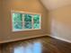 Bright bedroom features a large window with a view and gleaming hardwood floors at 339 Morgan Se Pl, Atlanta, GA 30317