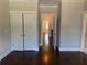 Bedroom with hardwood floors, closet, and access to bathroom at 339 Morgan Se Pl, Atlanta, GA 30317