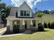 Charming two-story home with a covered porch, brick columns and well-maintained yard at 339 Morgan Se Pl, Atlanta, GA 30317