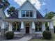 Charming home with a covered front porch, brick accents, and inviting curb appeal at 339 Morgan Se Pl, Atlanta, GA 30317