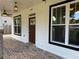 Inviting porch with brick floors, modern lighting, and large windows offering ample natural light at 339 Morgan Se Pl, Atlanta, GA 30317