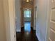 Bright hallway with hardwood floors and neutral paint, connecting various rooms in the home at 339 Morgan Se Pl, Atlanta, GA 30317