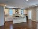 Bright kitchen with white cabinets, a large island, stainless appliances, and hardwood floors at 339 Morgan Se Pl, Atlanta, GA 30317