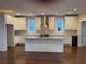 Open kitchen featuring white cabinets, a granite island, stainless steel appliances, and sleek design at 339 Morgan Se Pl, Atlanta, GA 30317