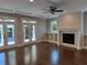 Living room with fireplace and built-in bookshelves near French doors at 339 Morgan Se Pl, Atlanta, GA 30317