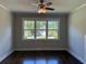 Bright living room with dark hardwood floors and large windows at 339 Morgan Se Pl, Atlanta, GA 30317