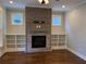 Living room with a fireplace and built-in bookshelves at 339 Morgan Se Pl, Atlanta, GA 30317