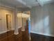 Spacious living area with modern lighting, hardwood floors, and easy access to other rooms at 339 Morgan Se Pl, Atlanta, GA 30317