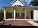 Covered patio with brick flooring and ceiling fans perfect for outdoor entertaining at 339 Morgan Se Pl, Atlanta, GA 30317