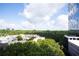 Overlooking verdant treetop views, with a modern glass building at 3445 Stratford Ne Rd # 903, Atlanta, GA 30326