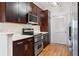 Elegant kitchen featuring stainless steel appliances, white countertops, and ample cabinet space at 3445 Stratford Ne Rd # 903, Atlanta, GA 30326