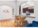 Well appointed kitchenette and sitting area with hardwood floors and barstool seating at 3445 Stratford Ne Rd # 903, Atlanta, GA 30326