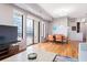 Open-concept living space featuring dining area, floor-to-ceiling windows, and sliding doors to balcony at 3445 Stratford Ne Rd # 903, Atlanta, GA 30326