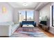 Bright living room featuring large windows with city views, hardwood floors, and contemporary furnishings at 3445 Stratford Ne Rd # 903, Atlanta, GA 30326