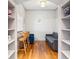 Cozy sitting area boasts hardwood floors, custom built-in bookshelves, and natural lighting at 3445 Stratford Ne Rd # 903, Atlanta, GA 30326