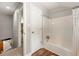 Bathroom with a tub and shower combination, plus access to the stairs at 4018 Dunbarton Ne Way, Roswell, GA 30075
