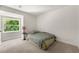 Bright bedroom featuring carpet floors, a window with a view, and neutral paint at 4018 Dunbarton Ne Way, Roswell, GA 30075