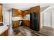 This kitchen features warm wood cabinets, modern appliances, and stylish flooring at 4018 Dunbarton Ne Way, Roswell, GA 30075