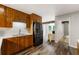 Kitchen with wood cabinets, stainless steel appliances, and an eat-in area at 4018 Dunbarton Ne Way, Roswell, GA 30075