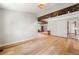 Spacious living room with exposed wooden beams and light hardwood flooring at 4018 Dunbarton Ne Way, Roswell, GA 30075