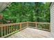 View of backyard from wooden patio with mature trees providing ample shade at 4018 Dunbarton Ne Way, Roswell, GA 30075