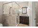 Bathroom with a glass enclosed shower and dark wood vanity at 110 Wellington Way, Canton, GA 30115