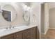 Neutral-toned bathroom featuring dual sinks and two mirrors at 110 Wellington Way, Canton, GA 30115